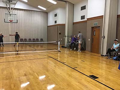 neighbors playing pickleball