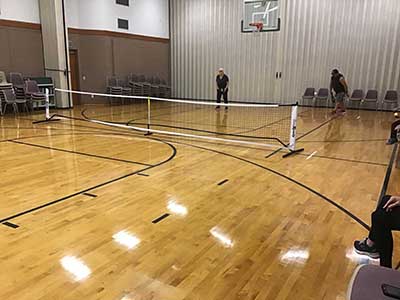neighbors playing pickleball