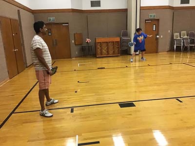 neighbors playing pickleball