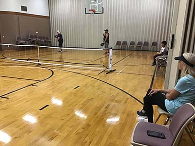 neighbors playing pickleball