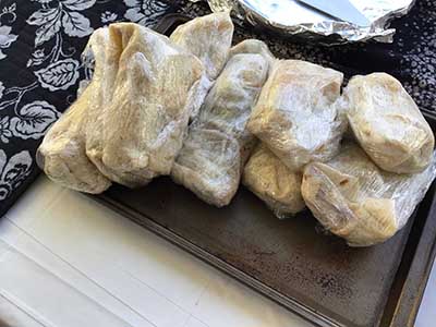breakfast burritos wrapped in plastic wrap
