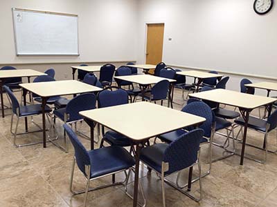 tables and chairs in Prescott room before setting up for event