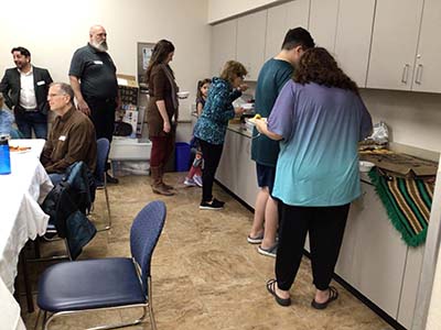 people at potluck dinner