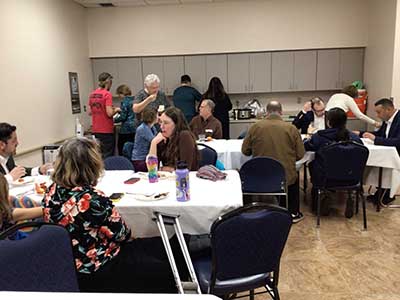 people at potluck dinner