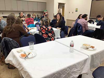 people at potluck dinner