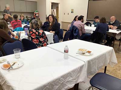 people at potluck dinner