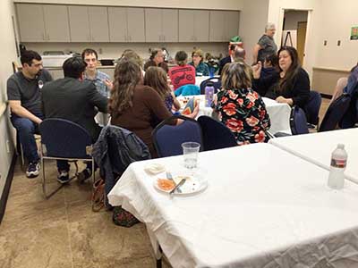 people at potluck dinner