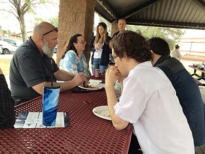 people at potluck dinner