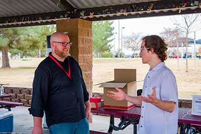 Forward Party representative speaking to neighbors