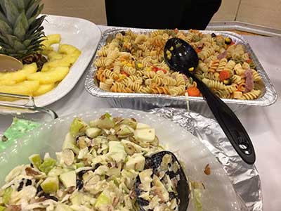pasta salad, pineapple, coleslaw