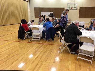 people at potluck dinner