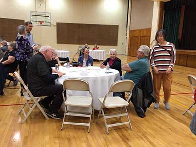 people at potluck dinner