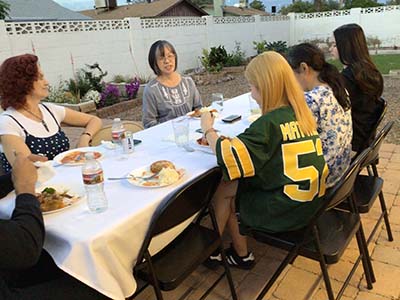 people at potluck dinner