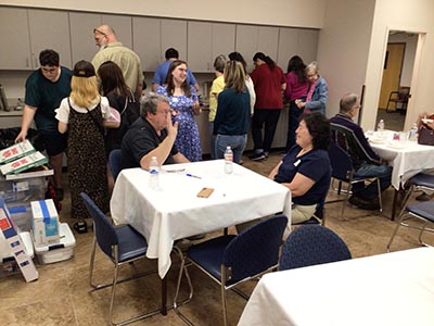 people at potluck dinner