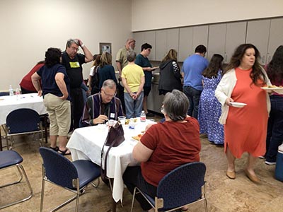 people at potluck dinner