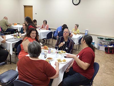people at potluck dinner