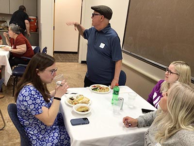 people at potluck dinner