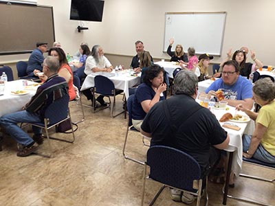 people at potluck dinner