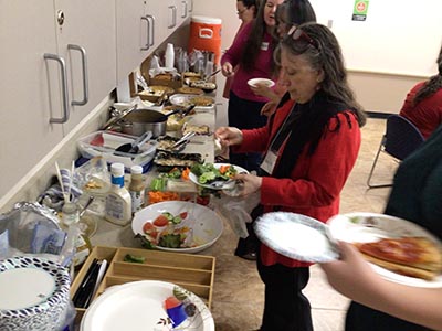 people at potluck dinner