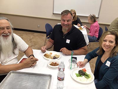 people at potluck dinner
