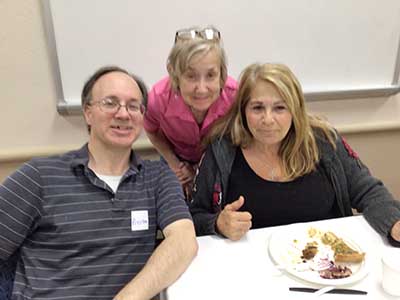 people at potluck dinner