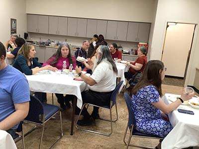 people at potluck dinner