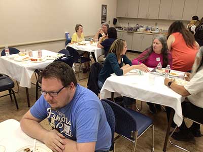 people at potluck dinner