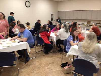 people at potluck dinner