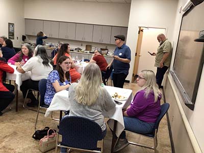 people at potluck dinner