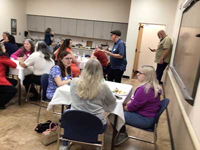 people at potluck dinner