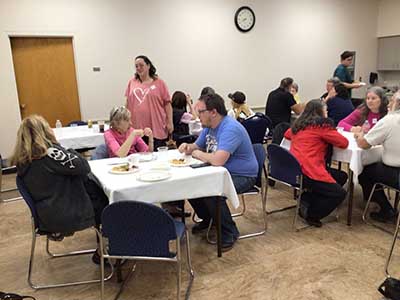 people at potluck dinner