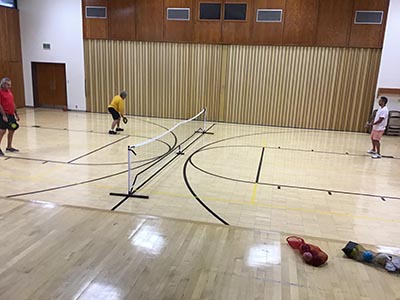 neighbors playing pickleball