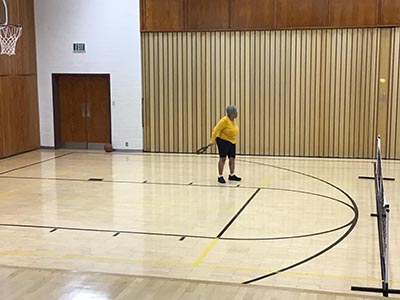 neighbors playing pickleball