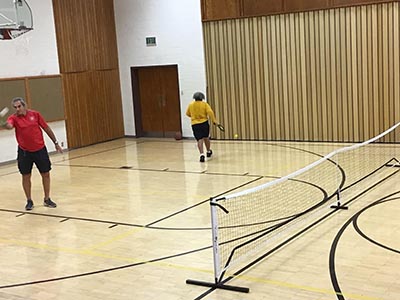 neighbors playing pickleball
