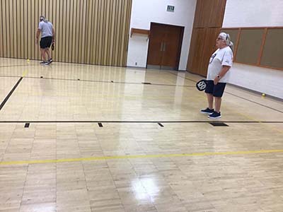 neighbors playing pickleball