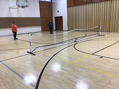 neighbors playing pickleball