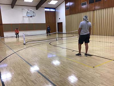 neighbors playing pickleball
