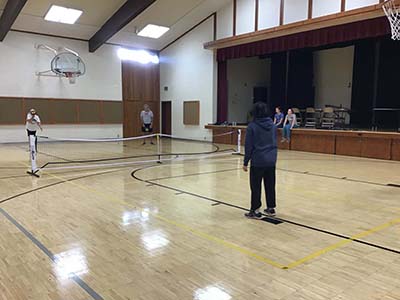 neighbors playing pickleball