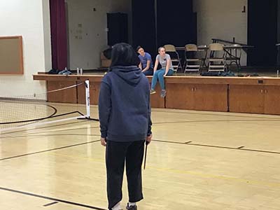 neighbors playing pickleball