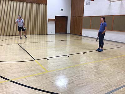 neighbors playing pickleball
