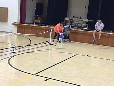 neighbors playing pickleball