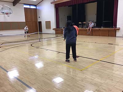 neighbors playing pickleball