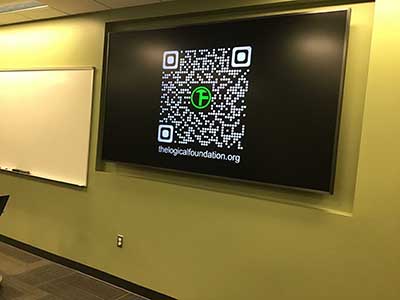 Logical Foundation logo and QR code on TV screen
