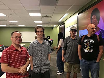 people at event, including event organizer and organizer of neighborhood group