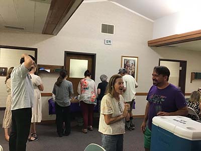 people at potluck dinner