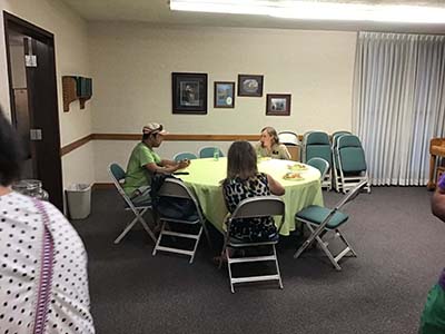 people at potluck dinner