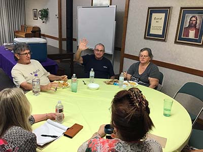 people at potluck dinner