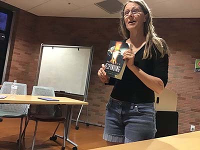 book club leader introducing book and author