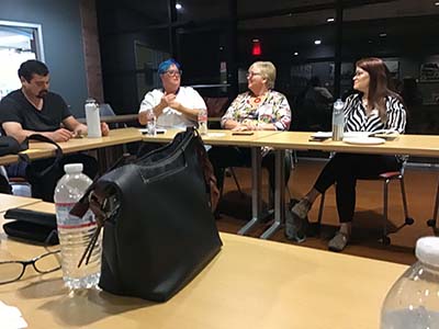 people at book club meeting with the author of the month's book