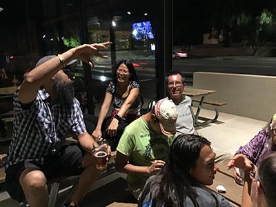 neighbors discussing movie the Creator at theater after seeing the film